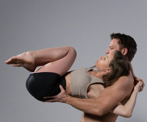 Person in a dynamic yoga pose showing strength and flexibility.